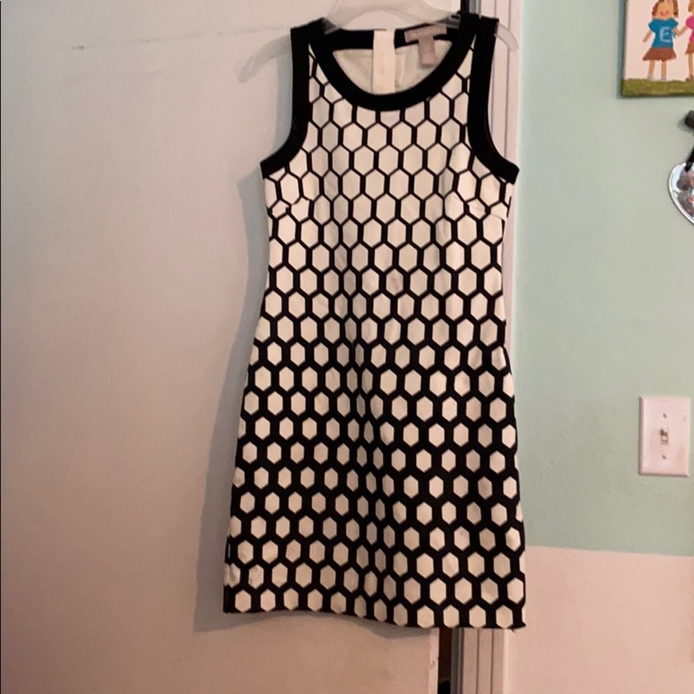 White dress with blue shapes